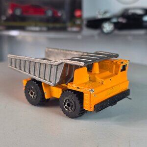 Vintage 1989 Matchbox Dump Truck Orange Silver Bed Patina Loose